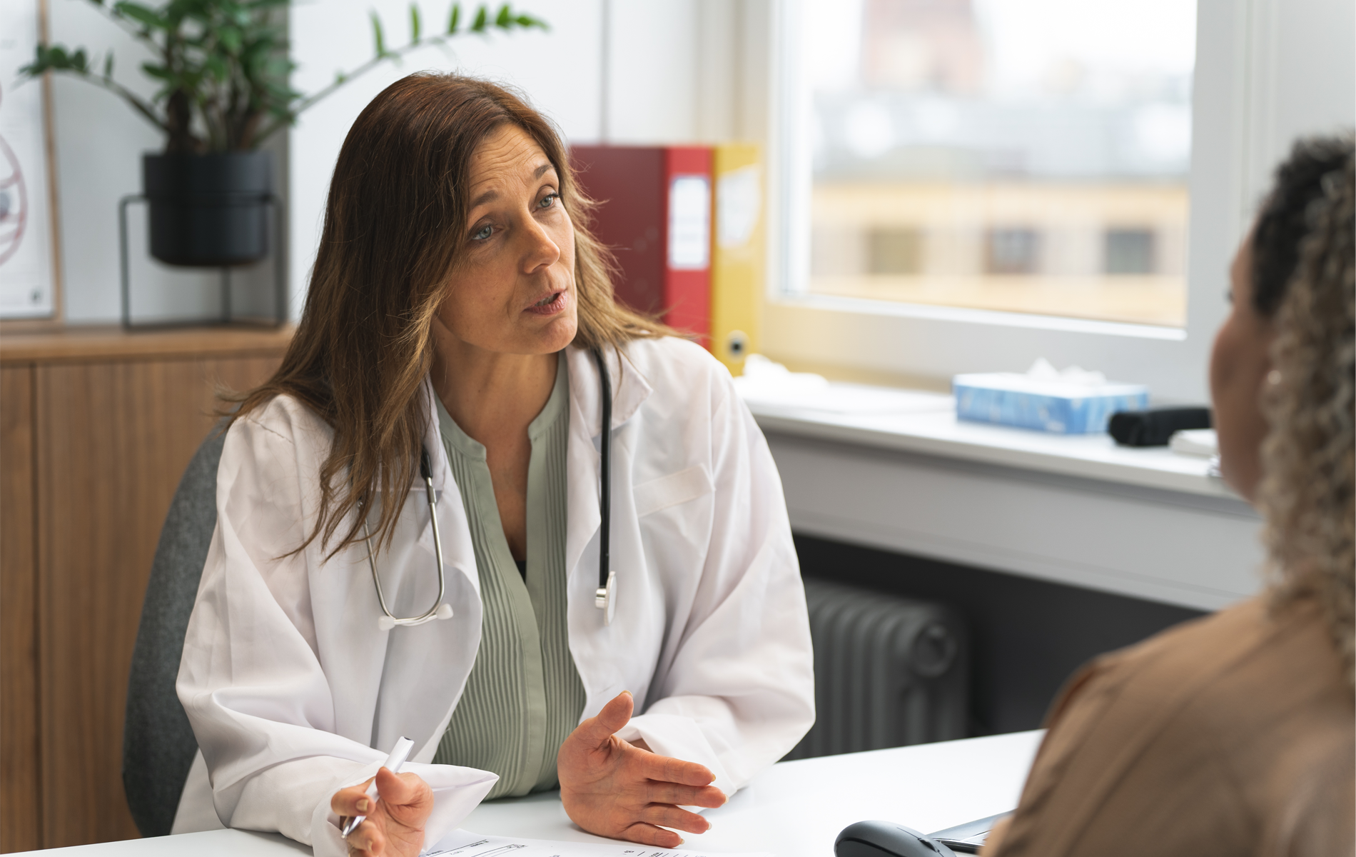 Woman speaking to doctor